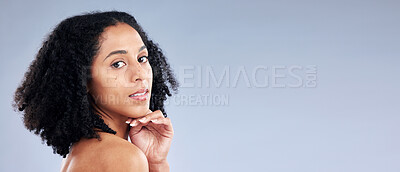 Buy stock photo Portrait, skincare and space with a model black woman in studio on a gray background for beauty. Face, aesthetic and mockup with a young female person at the salon for luxury wellness marketing