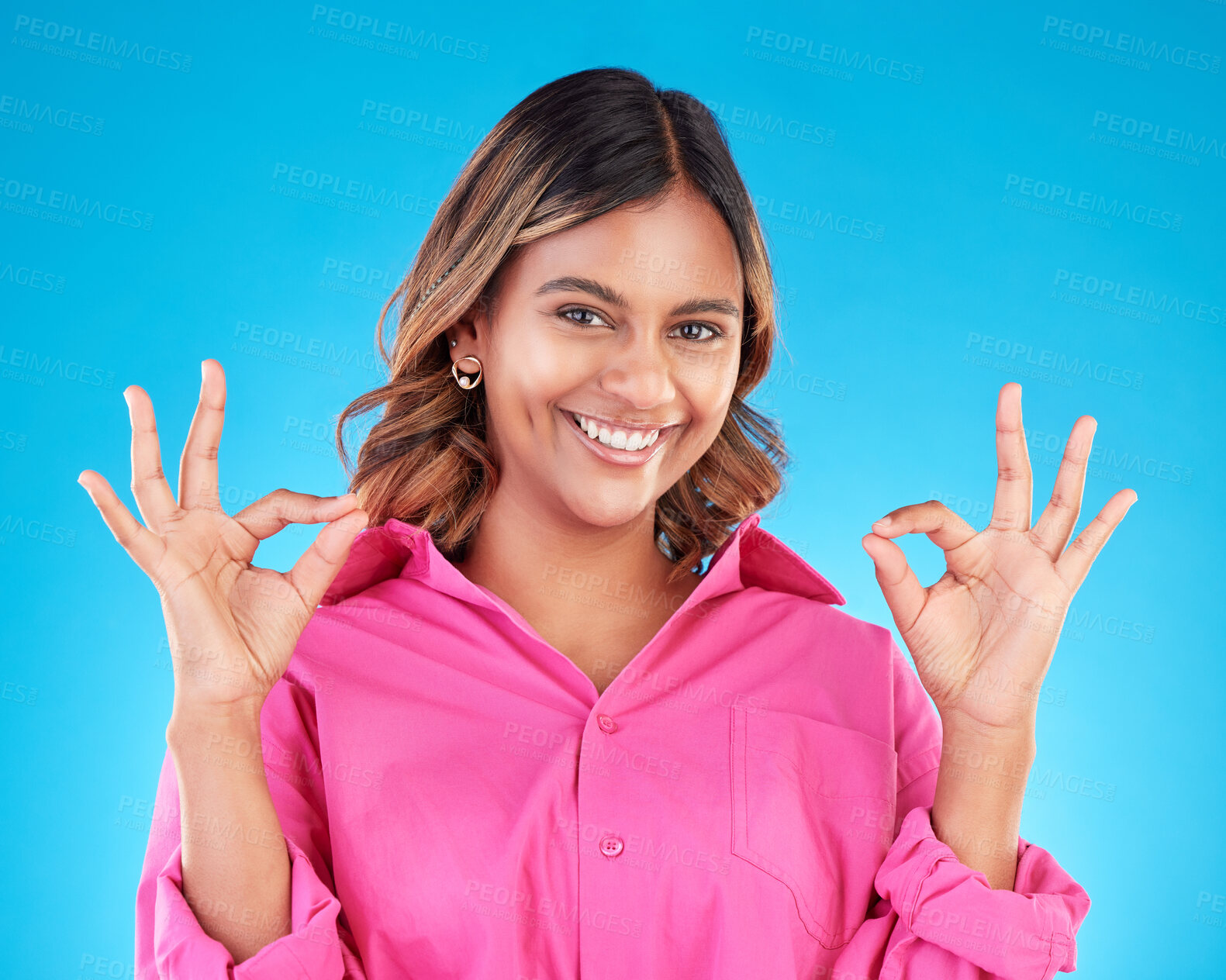 Buy stock photo Woman, hands and OK sign with portrait, agreement and positive feedback vote isolated on blue background. Happy female person, like emoji and success with support, hand gesture and review in studio