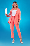 Computer, fashion and business woman for online marketing, social media planning or copywriting portrait in studio. E commerce, designer suit and full body of person on a laptop and blue background