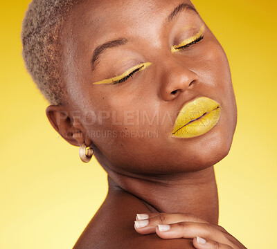 Buy stock photo Cosmetic, art and woman in a studio with makeup eyeliner and lipstick for cosmetology. Beauty, creative and young African female model with a colorful glamour face routine by a yellow background.