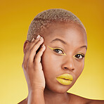 Portrait, cosmetics and african girl with skincare for glow in yellow studio with background in closeup. Woman, serious and natural makeup with hand on face for dermatology or wellness with lipstick.