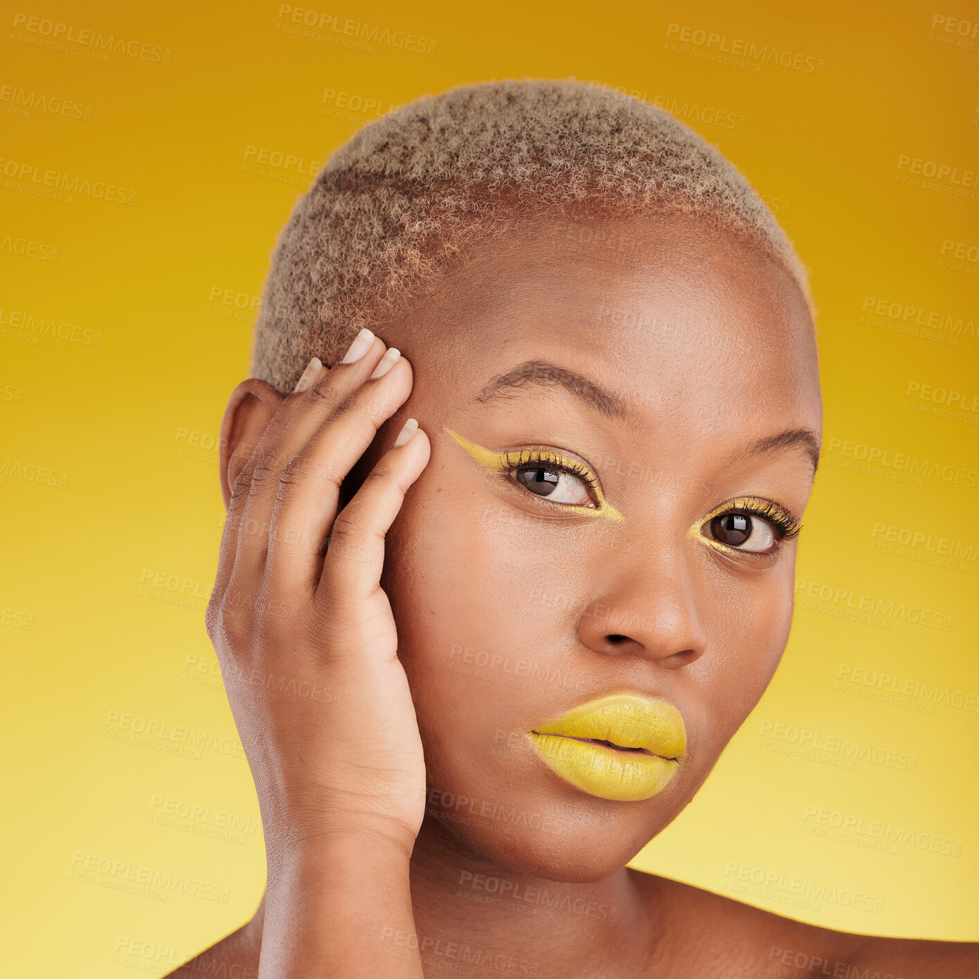 Buy stock photo Portrait, cosmetics and african girl with creative for glow in yellow studio with background in closeup. Woman, serious and skincare with bright makeup with hand on face for dermatology or wellness.