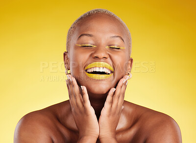 Buy stock photo Happy, gold makeup and a black woman on a studio background for creativity, skincare and beauty. Laughing, wellness and an African model or girl with lipstick isolated on a backdrop for an aesthetic