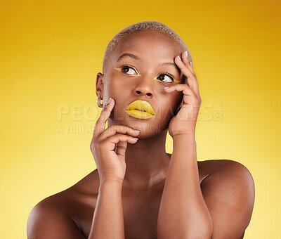 Buy stock photo Thinking, makeup and a black woman on a studio background for art or fashion. Ideas, gold and an African girl or model with yellow lipstick, cosmetics or young beauty on a backdrop for creativity