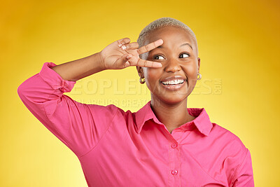 Buy stock photo Peace, hands and happy black woman in studio with thank you, vote or positive feedback on yellow background. V, sign and African female with good vibes, smile and freedom emoji, support or self love