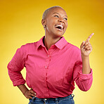 Happy, black woman and hand pointing in studio for news, deal or coming soon announcement on yellow background. Finger, smile and excited African female show list, promo or sign up contact info 

