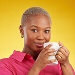 Smile, portrait and black woman relax with coffee in studio, calm and peaceful on yellow background. Tea, drinking and face of African female chilling with comfort beverage, happy and enjoy me time