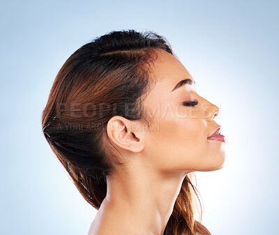 Buy stock photo Woman, hair care or profile of skincare for beauty, wellness or cosmetics in studio on blue background. Natural hairstyle, girl or model in facial treatment for healthy glowing skin or dermatology 