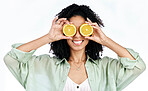Citrus, lemon and eyes of woman with fashion for organic wellness isolated in studio white background. Diet, fruit and happy or excited young person with healthy vitamin c energy, crazy and detox
