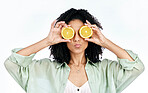 Vitamin c, lemon and eye of woman with a pout for organic wellness or fashion isolated in a studio white background. Diet, fruit and happy or excited young person with crazy citrus energy and detox