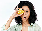 Vitamin c, lemon and eye of shocked woman with fashion for organic wellness isolated in a studio white background. Diet, fruit and healthy or excited young person with crazy citrus energy and detox