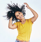 Hair, dancing and portrait of a woman with afro hairstyle, smile and fashion isolated in a studio white background. Smile, casual and young person with stylish or trendy clothes happy for freedom