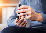 Man, hands and test blood sugar for diabetes, health analysis or medical glucometer results in office. Closeup of worker poke finger with needle to check insulin, monitor glucose or diabetic medicine