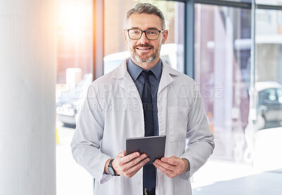 Buy stock photo Tablet, doctor and smile with portrait of man in hospital for consulting, digital and telehealth. Communication, medicine and healthcare with person in clinic for search, wellness and lens flare