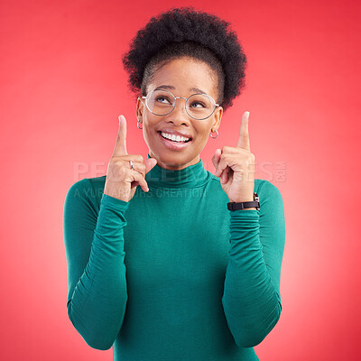 Buy stock photo Looking up, black woman and hand pointing in studio for announcement, deal or promotion on red background. Finger, smile and African female show news, sale and competition info, giveaway or vote