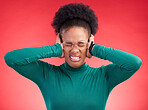 Stress, headache and hands on ears of black woman in studio with noise, complaint or frustration on red background. Migraine, anxiety and African female with vertigo, brain fog or hearing loss crisis