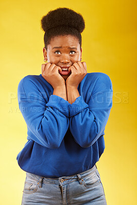 Buy stock photo Anxiety, fear and black woman biting nails in studio with terror, guilt and shocking drama on yellow background. Stress, gossip and African female with horror, fake news or worried about secret