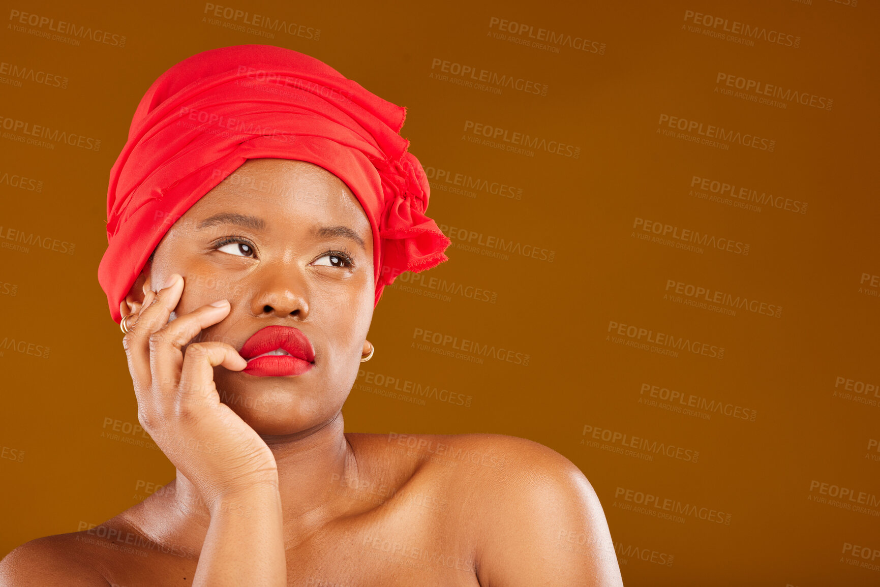 Buy stock photo Beauty, makeup and mockup with face of black woman in studio for space, creative and pride. Skincare, salon and red lipstick with female model on brown background for wellness, self care and glow