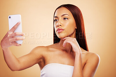Buy stock photo Studio, beauty or selfie with woman on social media to post picture or photo online on internet blog. Pictures, girl influencer or female model isolated on brown background for skincare or self care