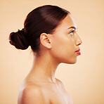 Skincare, makeup and side face of a woman on a studio background for natural and healthy wellness. Serious, facial and a girl with beauty, cosmetics and showing headshot profile on a backdrop