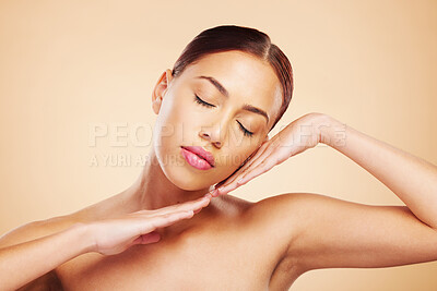 Buy stock photo Face, calm or woman with natural beauty in studio isolated on brown background for wellness or glow. Skin care shine, hands or zen Brazilian girl model with self love, eyes closed or facial cosmetics