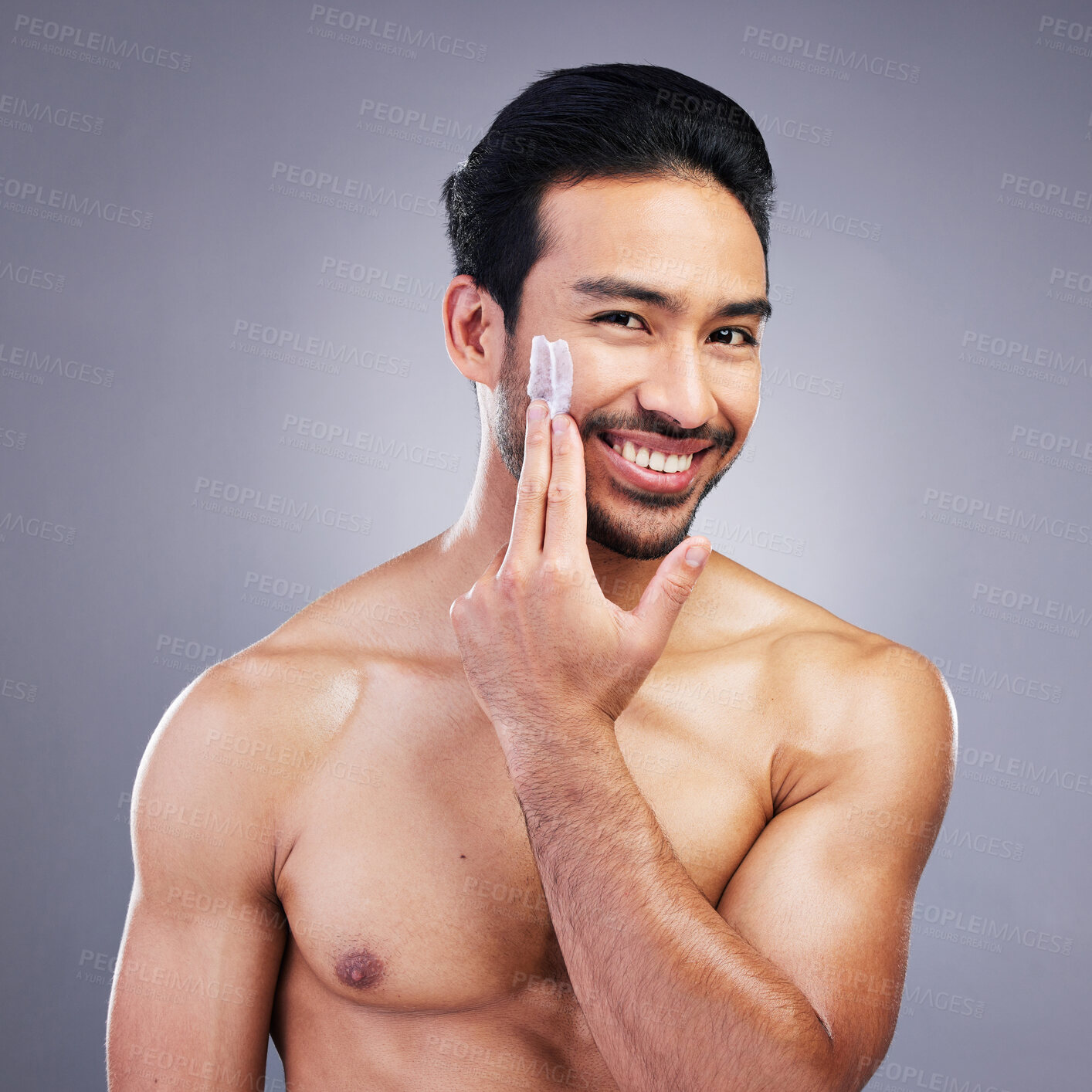 Buy stock photo Beauty, skincare or portrait of happy man with face cream or sunscreen product in grooming routine with cosmetics. Dermatology, studio background or male model smiling or applying facial cream lotion