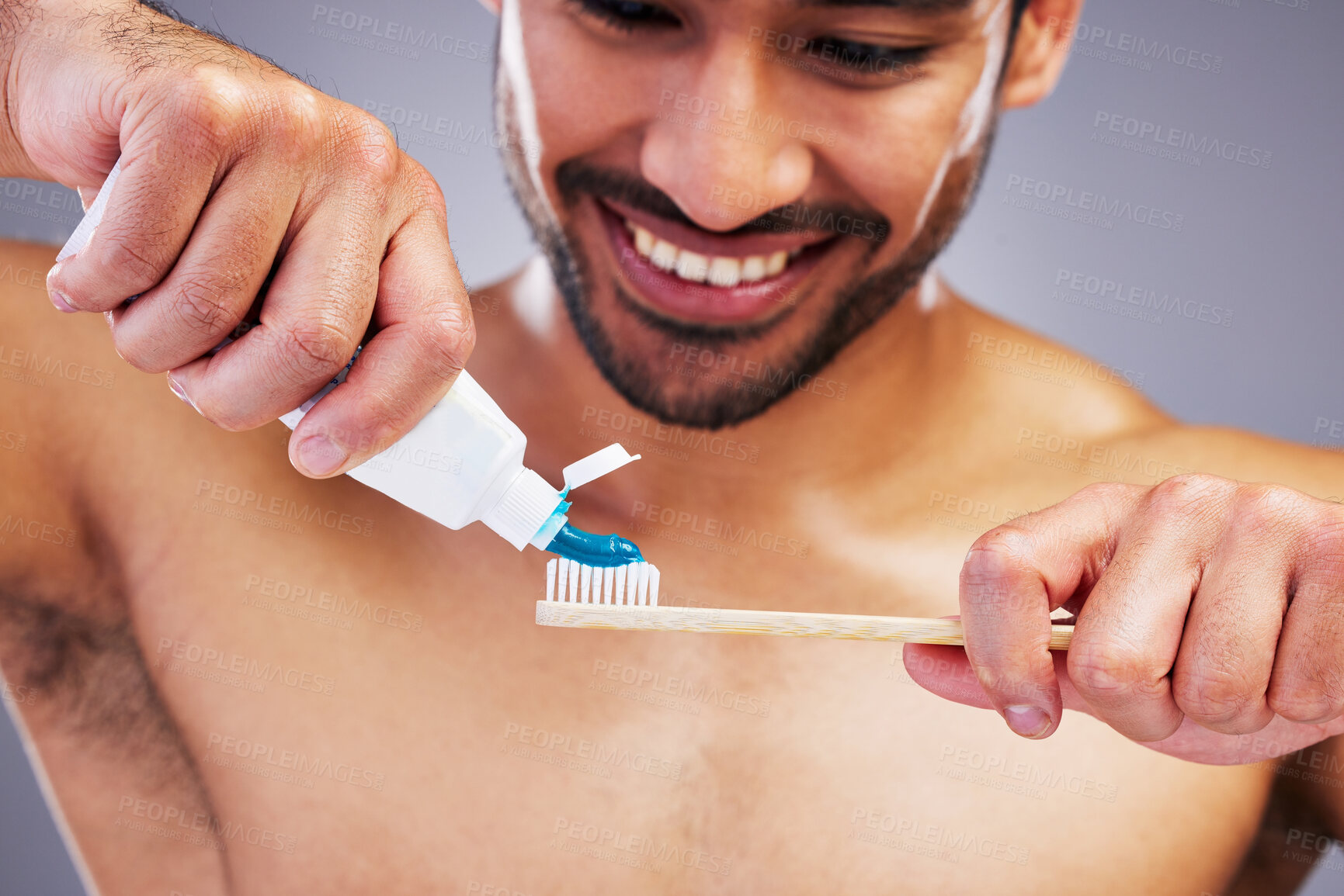 Buy stock photo Toothpaste, dental or happy man brushing teeth with smile or healthy oral hygiene grooming in studio. Eco friendly, tube product or male model cleaning mouth with a natural bamboo wood toothbrush 