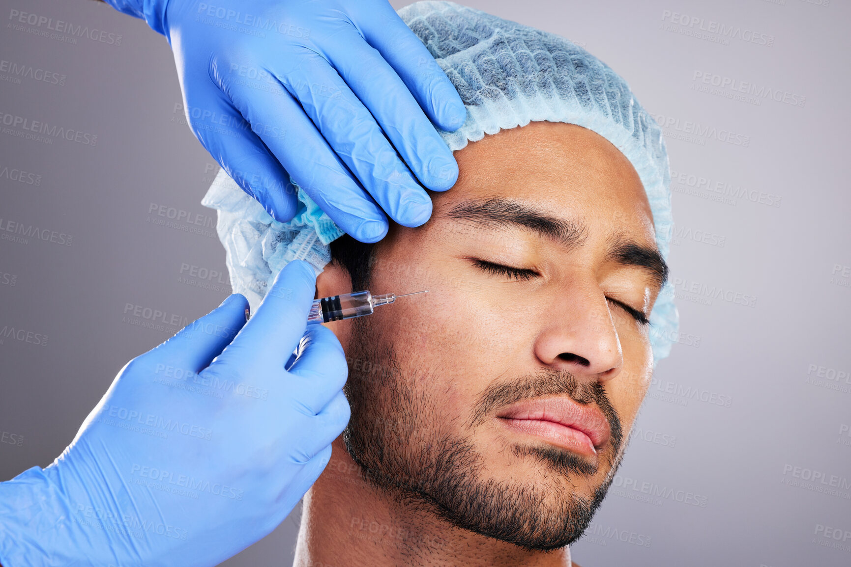 Buy stock photo Hands, implant and plastic surgery with a man in studio on a gray background for a silicon injection. Face, beauty and transformation with a male customer in a clinic for antiaging dermatology filler