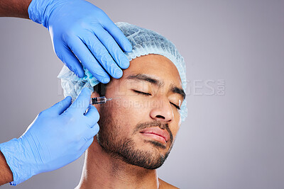 Hands, aesthetic and plastic surgery with a man in studio on a gray background for botox injection. Facial, beauty and transformation with a male customer in a clinic for antiaging filler or implant