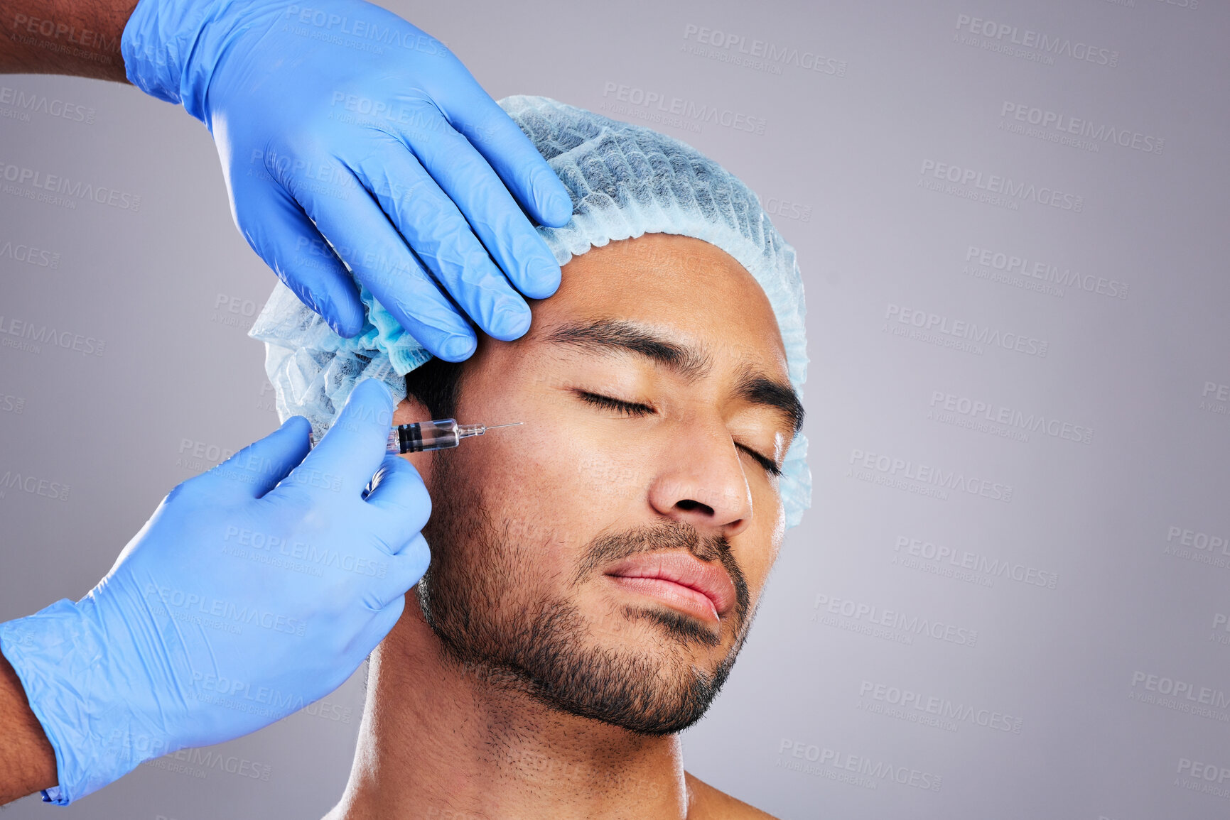 Buy stock photo Hands, aesthetic and plastic surgery with a man in studio on a gray background for silicon injection. Facial, beauty or transformation with a male customer in a clinic for antiaging filler or implant