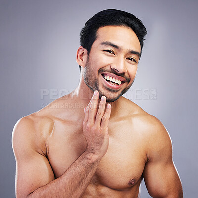 Buy stock photo Portrait, skincare and man with cosmetics, facial and dermatology on grey studio background. Face, male person or happy Asian model with grooming, body muscle and health with wellness, beard or glow