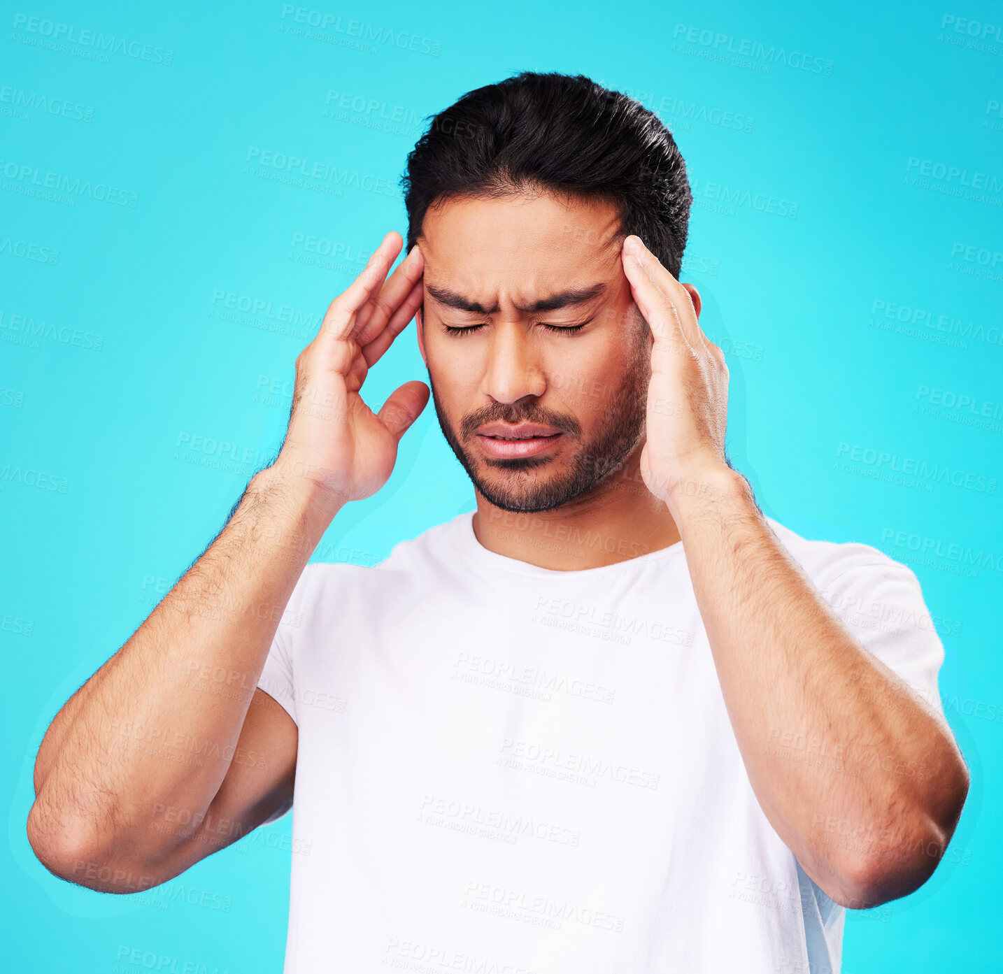 Buy stock photo Stress, pain and man with a headache, burnout and health problem on a blue studio background. Male person, anxiety and model with a migraine, frustrated and tension with strain, fatigue and pressure