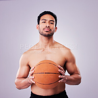 Buy stock photo Portrait, fitness and basketball with a serious man in studio on gray background for training or a game. Exercise, workout or sports and a shirtless young male athlete holding a ball with confidence