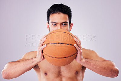 Buy stock photo Portrait, exercise and basketball with a sports man in studio on a gray background for game training. Fitness, workout or mindset and young shirtless male athlete with a ball and healthy body