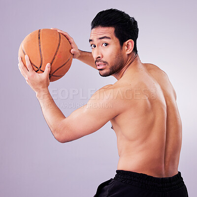 Buy stock photo Sports, exercise and basketball with a man playing in studio on a gray background for training or a game. Healthy, body or shirtless and a young male athlete holding a ball for fitness competition