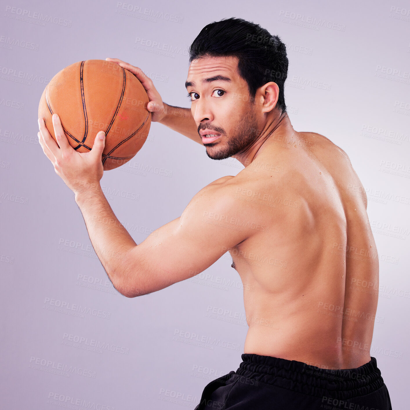 Buy stock photo Sports, exercise and basketball with a man playing in studio on a gray background for training or a game. Healthy, body or shirtless and a young male athlete holding a ball for fitness competition