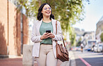 Walking, phone and a woman outdoor in a city with communication, internet connection and app. Happy professional business woman, urban road and smartphone for message, chat or social media on travel