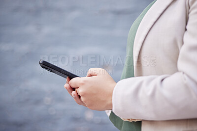 Buy stock photo Hands, phone and a person outdoor with communication, internet connection and mobile app. Closeup of a business woman, urban town and a smartphone while typing a message or chat on social media