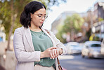 Time check, travel and a woman in the city for an appointment, early coomute and reading notification. Morning, working and a young female employee with a watch for a schedule or agenda in the road