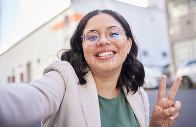 Buy stock photo Business woman, selfie and street with peace sign, smile or glasses for blog, finance career or city. Employee, portrait and happy with icon, memory or photography for profile picture on social media