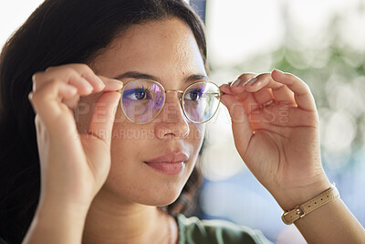 Buy stock photo Woman, glasses and thinking with eyes, optometry and health with ideas, choice and fashion in store. Girl, frame and lens for wellness, vision and test for eyesight, decision and customer experience