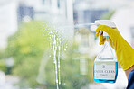Hands, cleaning spray and bottle at windows for hygiene of bacteria, dust and germs. Closeup, housekeeping and cleaner with chemical liquid product for dirt, glass surface and hospitality services 