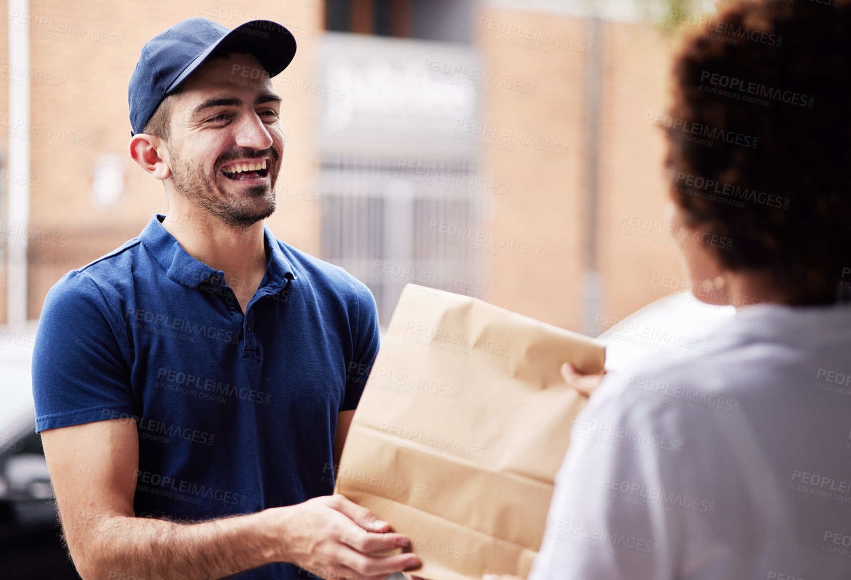 Buy stock photo Happy delivery man, package and a customer at door with a paper bag for e commerce and shipping. Logistics, online shopping and freight or courier worker laughing and giving a woman a fast food order