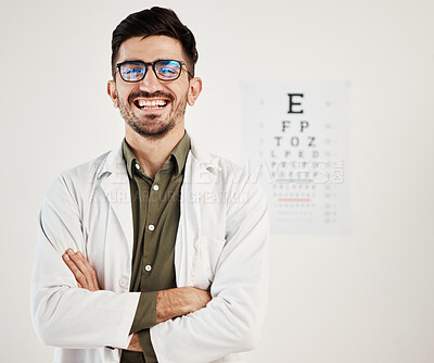 Buy stock photo Eye exam, arms crossed and portrait of man optometrist with smile, confidence and friendly service in consultation office. Ophthalmology, face and happy male eye expert proud of vision testing career