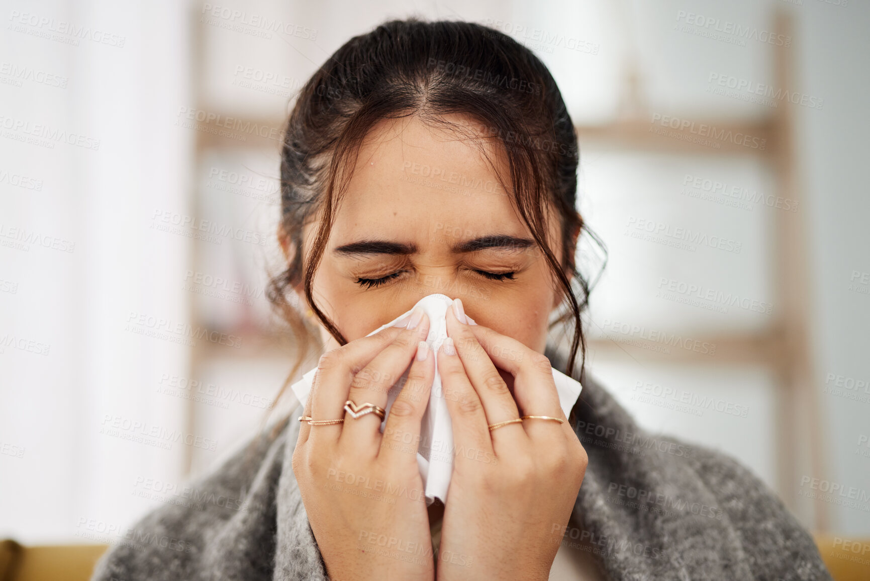 Buy stock photo Tissue, nose and sick woman sneezing in living room with allergy, cold or flu in her home. Hay fever, sinusitis and female with viral infection, risk or health crisis in lounge with congestion 
