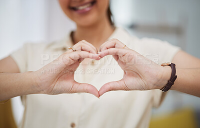 Buy stock photo Closeup, heart and hands of woman for care, charity and kindness of donation at home. Female person with finger shape for love icon, thank you and emoji reaction in support of freedom, review or hope