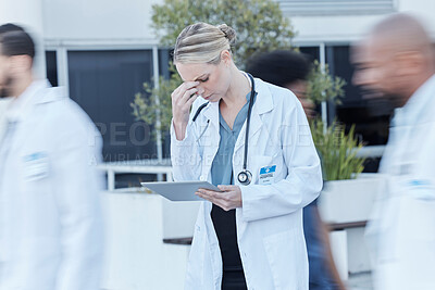 Buy stock photo Tablet, doctor and woman with stress in busy hospital, fatigue and burnout. Tech, medical professional and person with problem, crisis or challenge, headache and anxiety for mistake, fail or accident