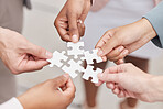 Business people, hands and puzzle for teamwork, mission and problem solving of challenge, synergy and cooperation. Closeup of employees with jigsaw for integration, collaboration or planning solution