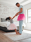 Dance, bedroom and a father with his daughter for fantasy fun together in their home in the morning. Love, family or children with a man and girl kid moving to music while bonding for trust or care