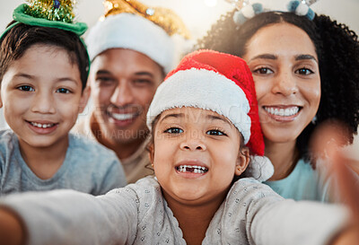 Buy stock photo Parents, kids and christmas selfie in family home, smile and excited for event, culture and celebration together. Mom, dad and young children with xmas memory, photography or profile picture on blog